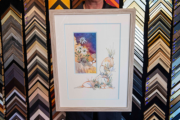 Original Gloria Muddle artwork with its hand-painted mountboard preserved during custom reframing at Sunset Framing & Gallery, Port Macquarie.