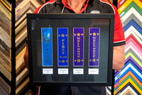 Kids athletics and sports award ribbons including first place and well done ribbons, professionally mounted and custom framed in Port Macquarie.