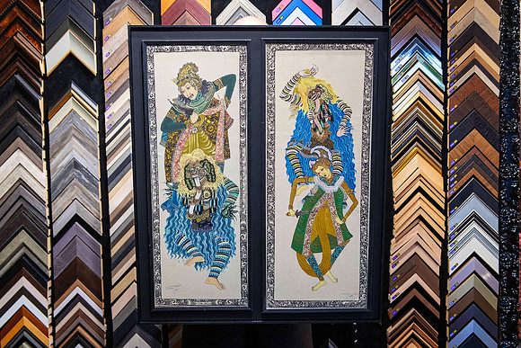 Pair of detailed textile artworks displayed together in a custom black timber frame by Sunset Framing & Gallery Port Macquarie.