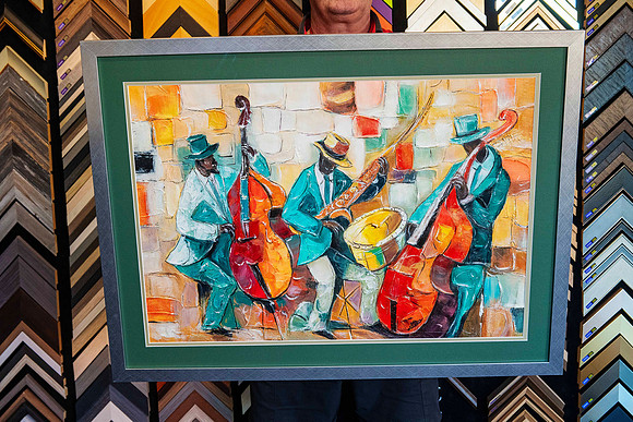 Colourful jazz musicians artwork featuring double bass, saxophone and drums, professionally custom framed with deep green matboard and metallic frame in Port Macquarie.