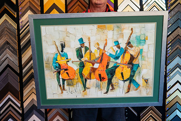 Colourful artwork of musicians playing cellos professionally custom framed with deep green matboard, fine neutral border and contemporary metallic frame in Port Macquarie.