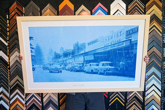 Vintage photograph for Settlers Inn transformed into a large blue-toned poster and custom framed in light timber as commercial wall art in Port Macquarie.