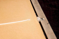 Old picture frame with broken and frayed hanging cord requiring replacement during a professional frame repair in Port Macquarie.