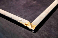 Broken timber picture frame corner after falling from a wall, requiring replacement frame rails as part of a professional frame repair in Port Macquarie.