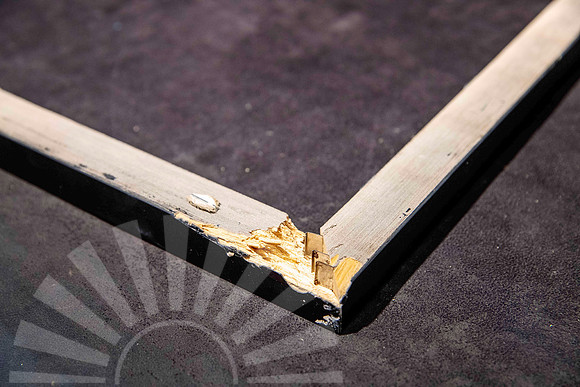 Broken timber picture frame corner after falling from a wall, requiring replacement frame rails as part of a professional frame repair in Port Macquarie.