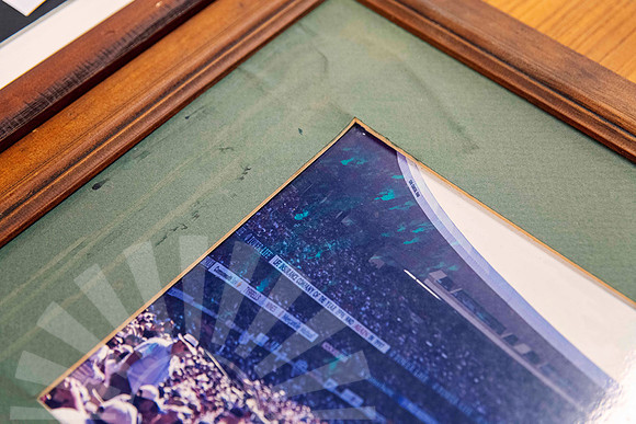Older timber picture frame with water-damaged and aged green matting brought to Sunset Framing & Gallery for professional frame repair in Port Macquarie.