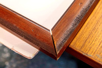 Timber picture frame with separated corner joint before being cleaned and rejoined during professional frame repair in Port Macquarie.