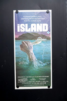 Original 1980 The Island Australian daybill movie poster featuring Charles Gehm artwork of a tattooed hand holding a knife rising from the ocean, starring Michael Caine and David Warner.