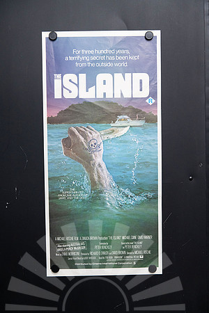 Original 1980 The Island Australian daybill movie poster featuring Charles Gehm artwork of a tattooed hand holding a knife rising from the ocean, starring Michael Caine and David Warner.