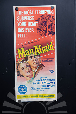 Original 1957 Man Afraid Australian daybill movie poster featuring vivid red and yellow illustrated artwork with George Nader and Phyllis Thaxter.