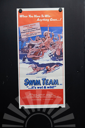 Original 1979 Swim Team Australian daybill movie poster with colourful illustrated poolside comedy artwork, swimmers, shark and Animal House stars James Daughton and Stephen Furst.