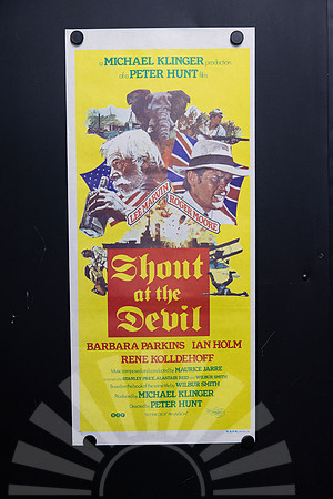 Original 1976 Australian Daybill movie poster for Shout at the Devil starring Lee Marvin and Roger Moore, featuring colourful yellow illustrated African adventure and First World War artwork.