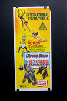 Original Australian Daybill movie poster for The Big Arena featuring colourful vintage circus artwork with trapeze artists, Oleg Popov the clown, an elephant and performing bears on a bright yellow ba