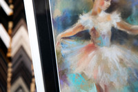 Close-up detail of a softly coloured ballerina artwork framed with a wide black mat and slim white custom picture frame in Port Macquarie.