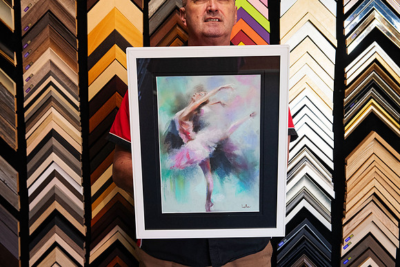 Expressive ballet dancer artwork in soft pink, aqua and pastel tones, custom framed with a wide black mat and contemporary white frame in Port Macquarie.