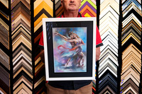 Colourful expressive artwork of a dancing couple custom framed with a wide black mat and contemporary white picture frame by Sunset Framing & Gallery in Port Macquarie.
