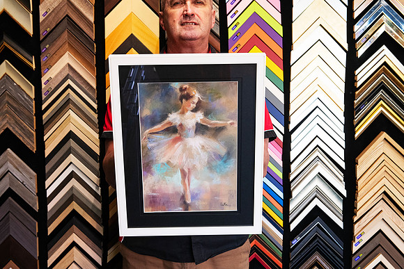Expressive ballerina artwork in soft pastel colours custom framed with a wide black mat and contemporary white picture frame by Sunset Framing & Gallery in Port Macquarie.