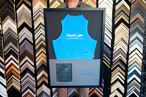 Blue 2004 Australian Wakeboard Nationals champion singlet custom framed with trophy and personalised plaque in a black sports memorabilia frame in Port Macquarie.