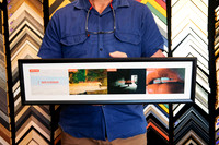 Four collected travel prints displayed together in a wide black custom frame with a clean white surround.