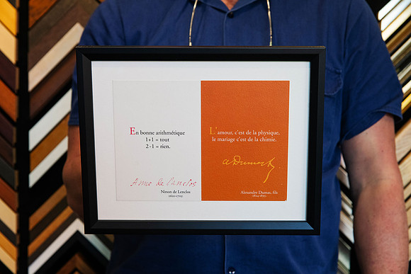Pair of collected French printed travel pieces custom framed together in a simple black frame with white surround.