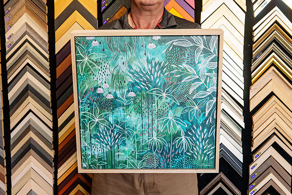 Green botanical artwork professionally custom framed in a light natural timber frame in Port Macquarie.