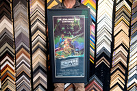 The Empire Strikes Back Star Wars movie poster custom framed with dark mat and black frame.