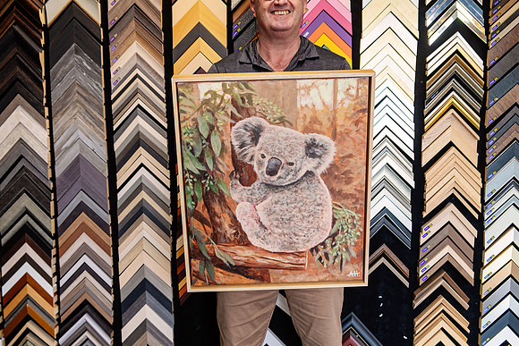 Original koala painting finished in a slim natural timber float-style frame.