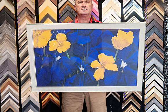 Blue and yellow floral artwork professionally custom framed in a silver-toned picture frame in Port Macquarie.