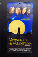 Moonlight & Valentino Australian Daybill with four female cast portraits above a blue night sky, a giant yellow moon, and silhouettes of a person and dog.