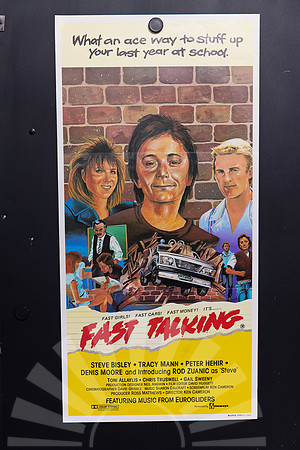 Fast Talking Australian Daybill with illustrated teenage characters against a brick wall, a car bursting through bricks, and a red title above yellow credits.