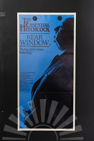 Rear Window Australian Daybill from The Essential Hitchcock series, with a large black profile of Alfred Hitchcock on blue and the tagline “Seeing isn’t always believing.”