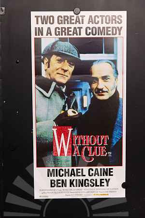 Without a Clue Australian Daybill featuring Michael Caine in a deerstalker holding a pipe beside Ben Kingsley, with a red-and-white title and bold black lettering on white.