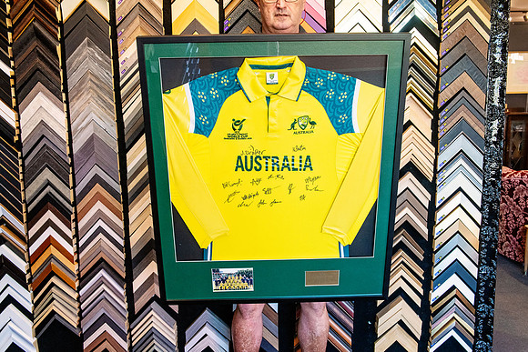 Signed Australian cricket shirt custom framed with team photograph and plaque.