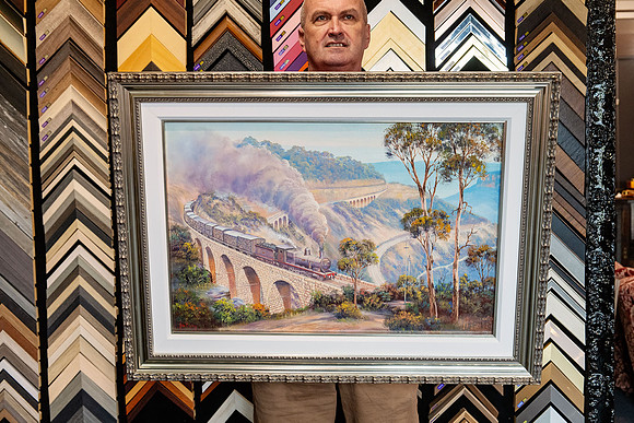 Large steam train and viaduct artwork professionally custom framed with an ornate silver frame in Port Macquarie.