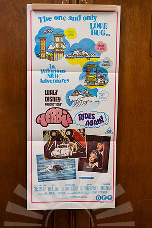 Original vintage Herbie Rides Again Australian movie poster featuring Herbie the Love Bug and colourful Disney character artwork.
