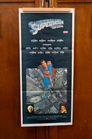 Original vintage Superman The Movie Australian movie poster featuring Christopher Reeve as Superman flying above city artwork.